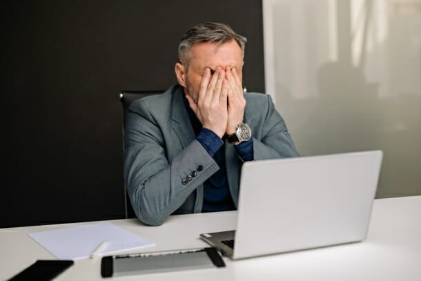 frustrated man at a desk
